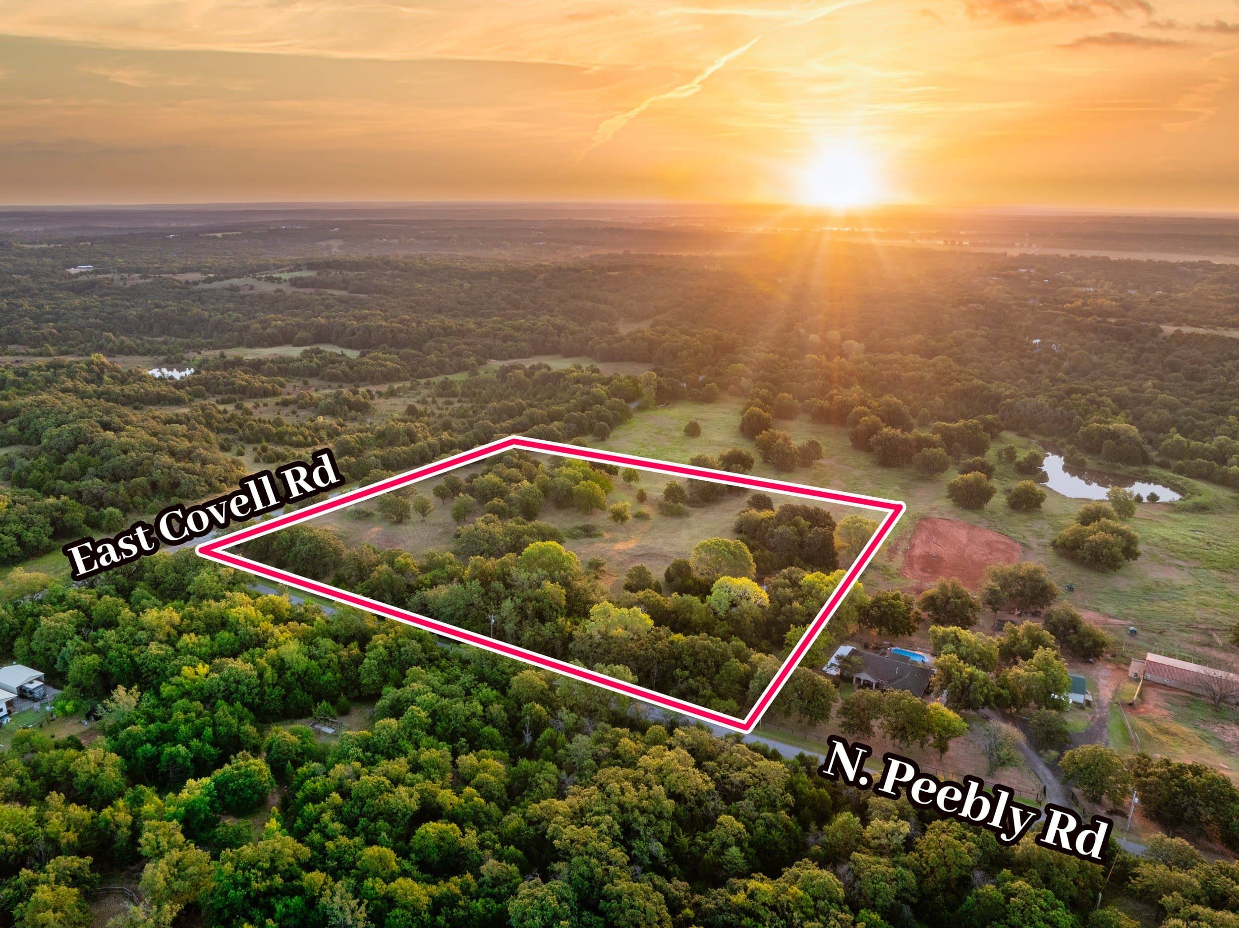 Sunset aerial with the parcel outlined and the bounding roads labelled