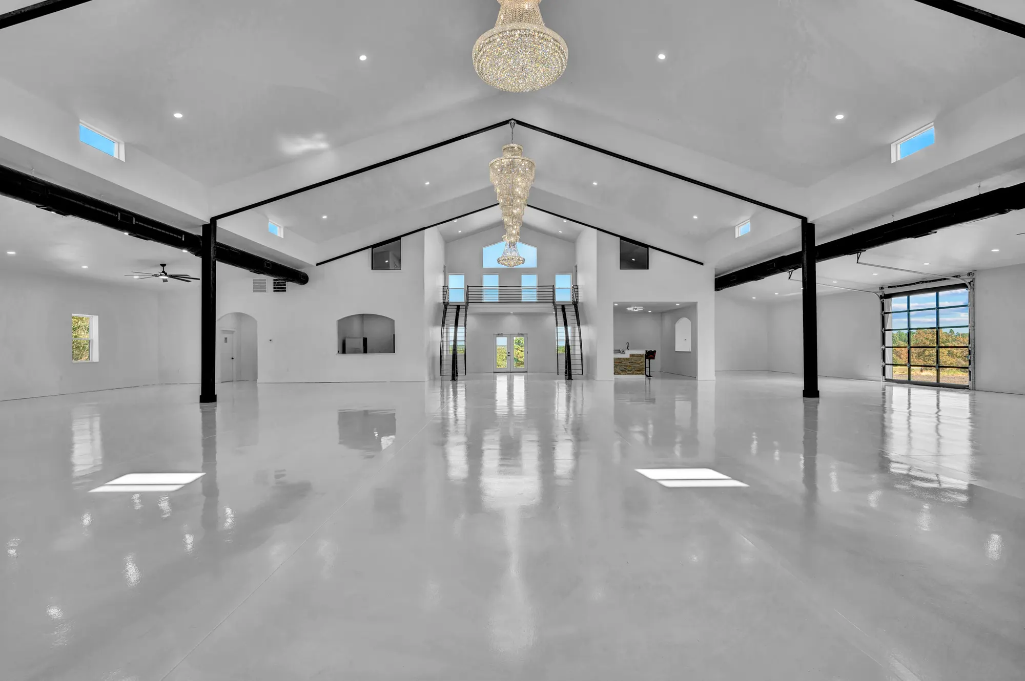 Event hall in Shawnee with polished concrete, steel trusses and a crystal chandelier