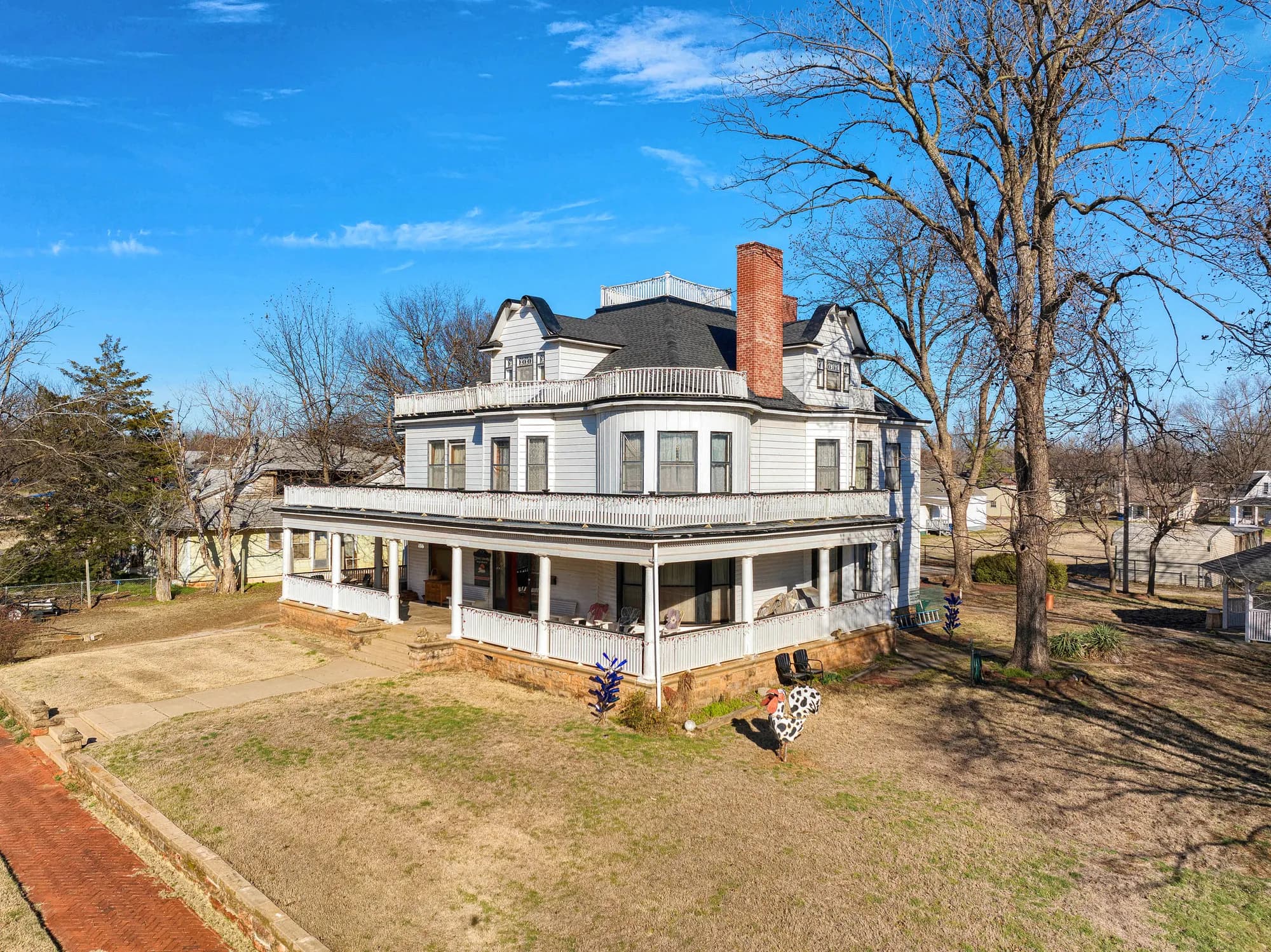 Aerial view of a restored Victorian home and its grounds