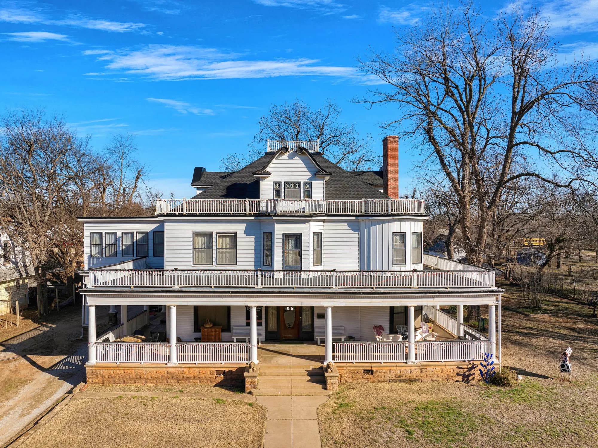 Restored Victorian home with a two-storey wraparound porch