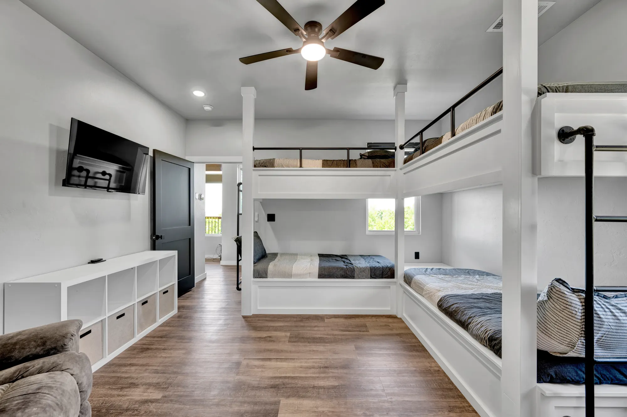 Built-in bunk room sleeping four beneath a vaulted ceiling