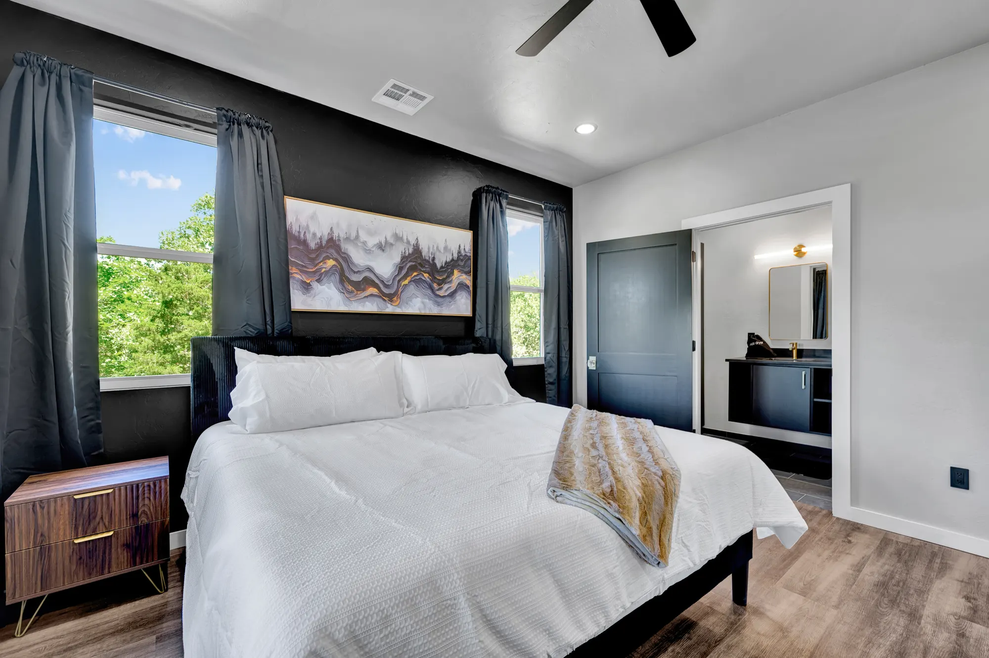 Guest suite with an ensuite bathroom and a view over the treeline